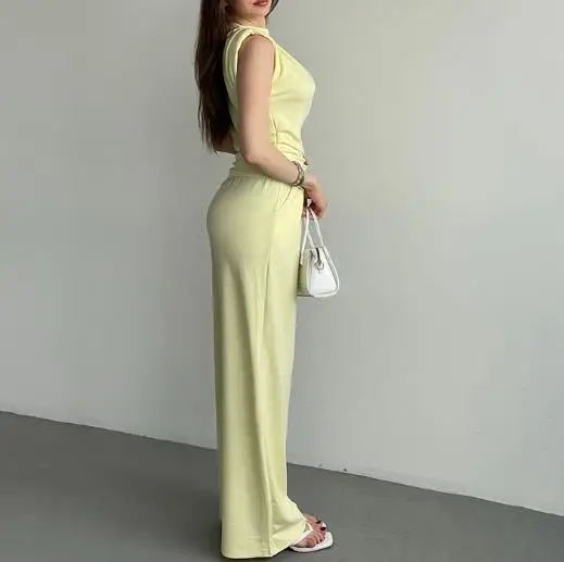 Комплект из двух предметов, женский наряд, весна 2024, новый однотонный комплект без рукавов с наклонным воротником и неровным подолом, топ и карман, прямые брюки