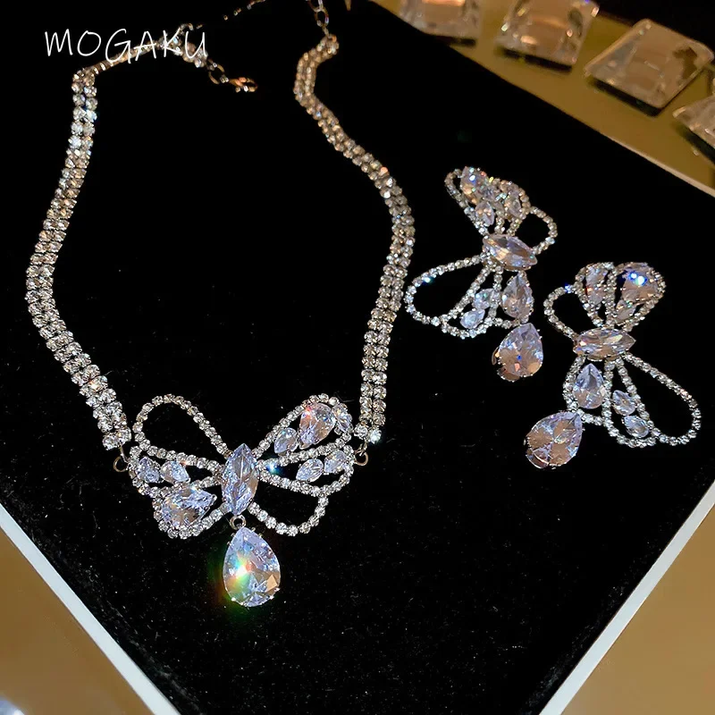 

MOGAKU Sexy Sweet Choker Chain Rhinestone Necklaces for Women Fashion Crystal Bowknot Shiny Earrings Necklace Jewelry Sets Girls