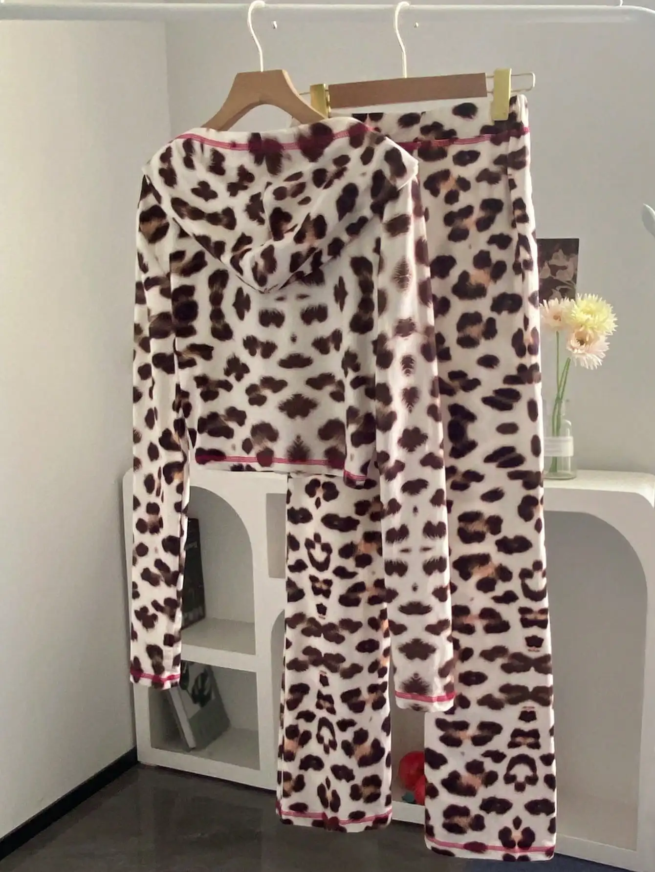 Leopard Print 2-Piece Set hooded top detail demonstrating full-zip closure and kangaroo pocket functionality