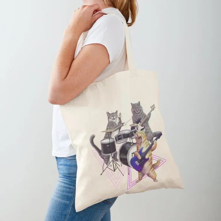 Cat band- Rock band kitties playing the bass, electric guitar, and drums Tote Bag