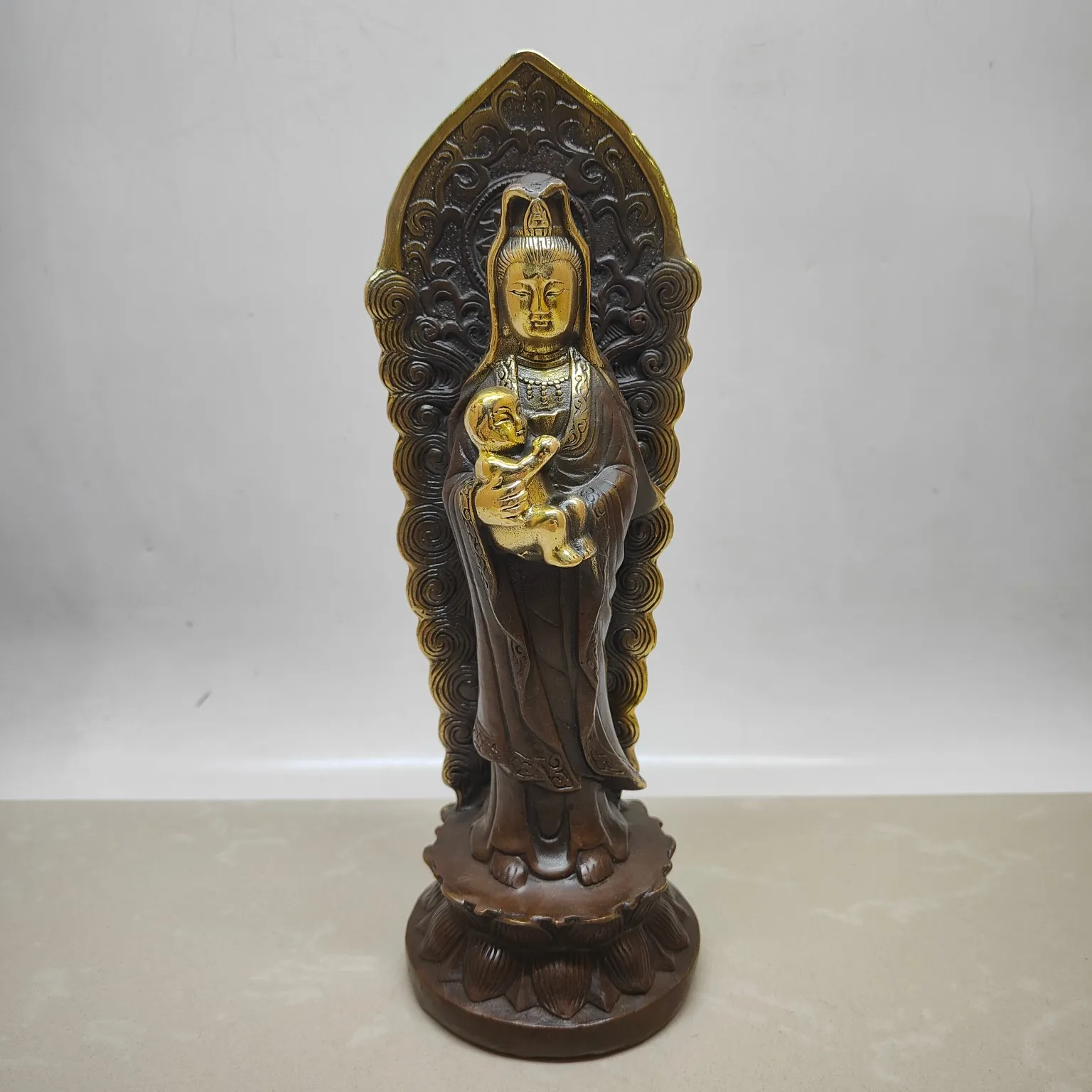A backlit statue of Guanyin, the Bodhisattva of Compassion, holding a child.),Free shipping