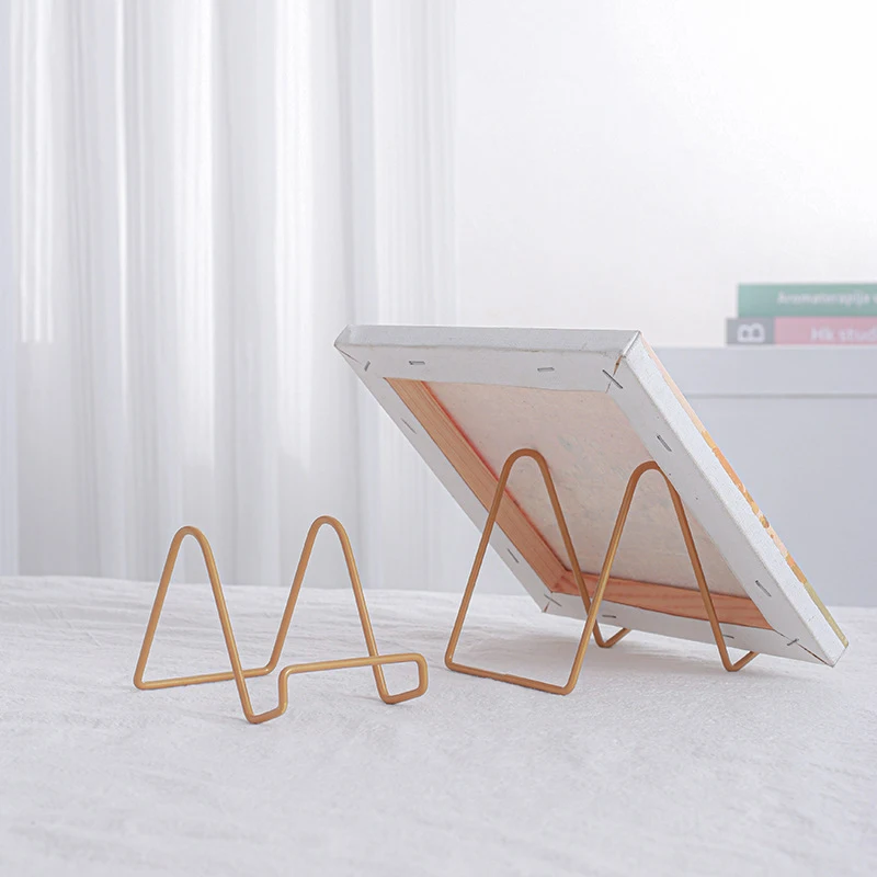 خمر نمط خمر حامل السجل ، بسيط الإبداعية المعادن عرض موقف ، CD تخزين الرف ، الحديد المطاوع إطار الصورة ، قوس ، 1 قطعة