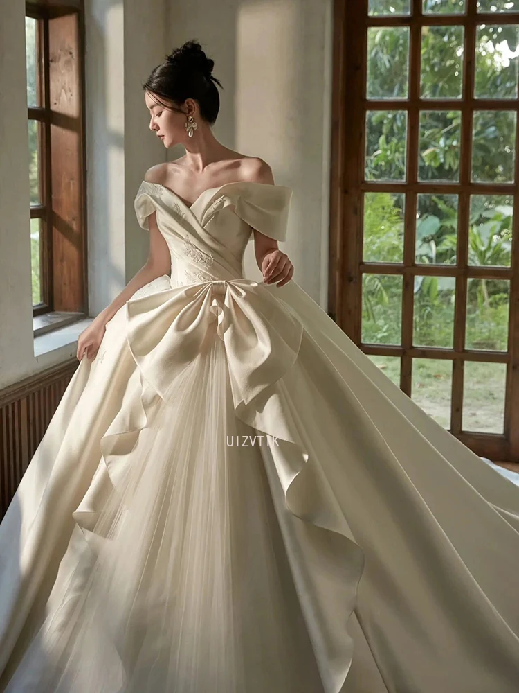 فساتين زفاف بيضاء فاخرة من الساتان للنساء 2026 فستاين سهرة/فساتين الحفلات بدون أكتاف وأربطة طول الأرض Vestidos De Novia مصنوعة حسب الطلب