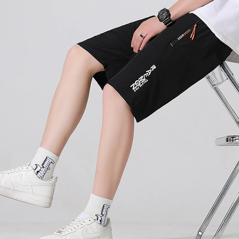 Uomo lettera stampa sport Outdoor asciugatura rapida pantaloni corti dritti traspiranti 2024 estate tasche Casual maschili pantaloncini larghi da spiaggia