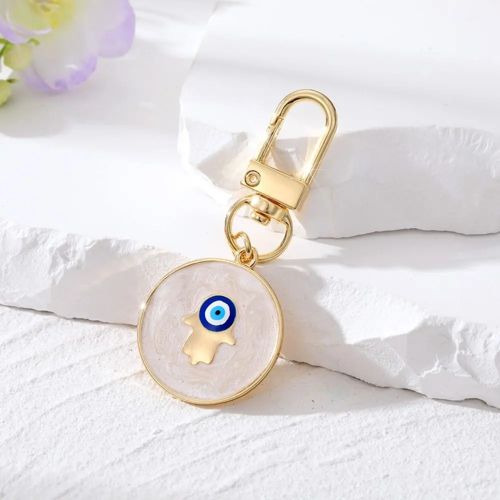 LLavero de ojo de demonio de estrella de resina de dibujos animados, colgante de ojo azul turco de aleación de aceite que gotea, colgantes de bolso de estilo popular para uso diario
