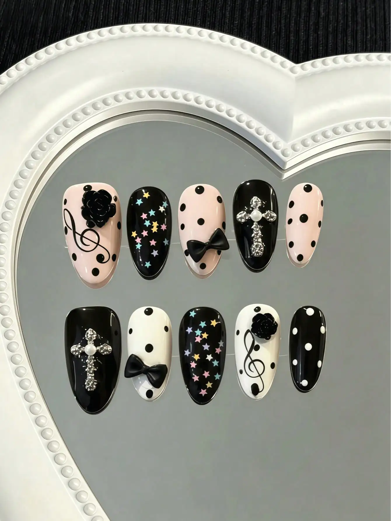 10 Pieces of Handmade Almond-Shaped Full-Cover Nail Tips, Medium-Length, with Black and Pink Color Contrast, Featuring Hand-Painted Polka Dots, Musical Notes, Stars, and 3D Black Roses, Bowknots, and Rhinestone Decorations, in a Sweet and Cool Y2K Style, Suitable for Women and Girls, Perfect for Summer Vacations, Graduation Season, and Personalized Outfits, Also Ideal as a Gift, Comes with 1 Piece of Jelly Glue and 1 Nail File