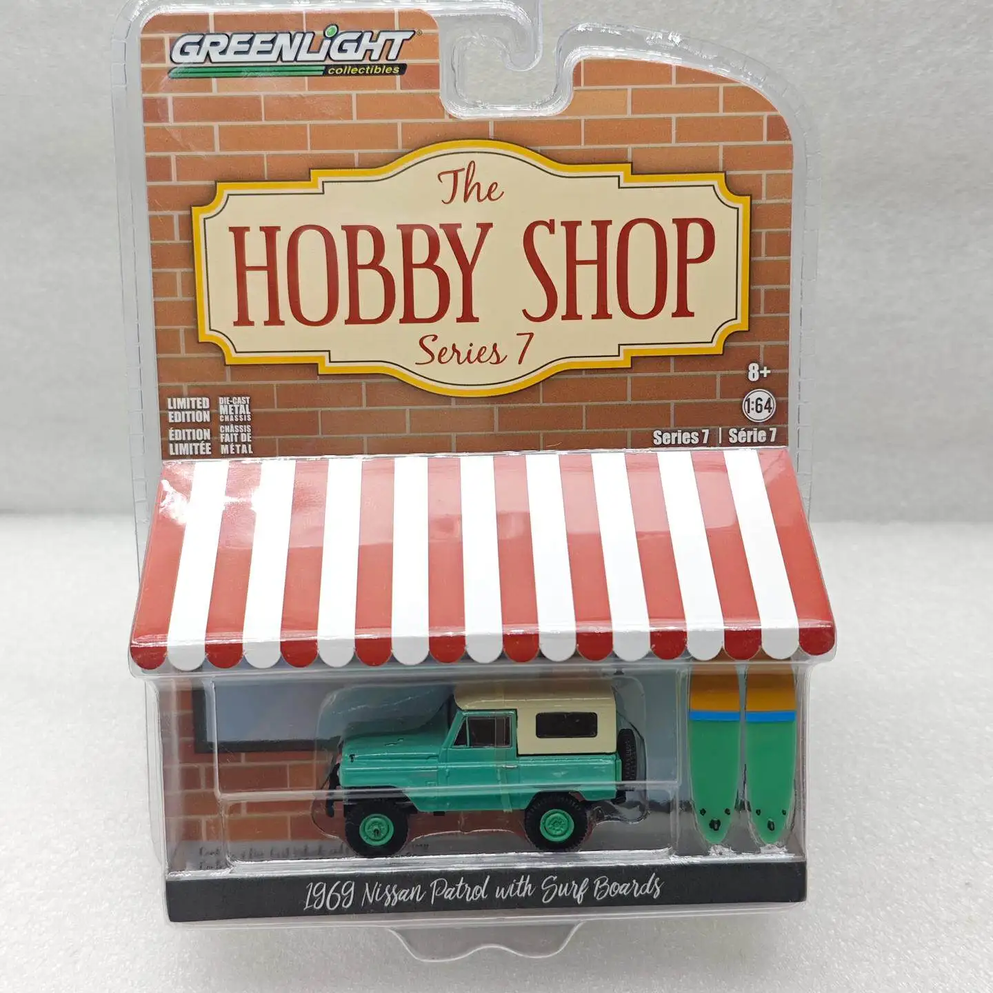 

GreenLight 1:64 Hobby Shop Series 7 - 1969 Nissan Patrol (60) with Surfboard Diecast Alloy Car Model Collectible Gift