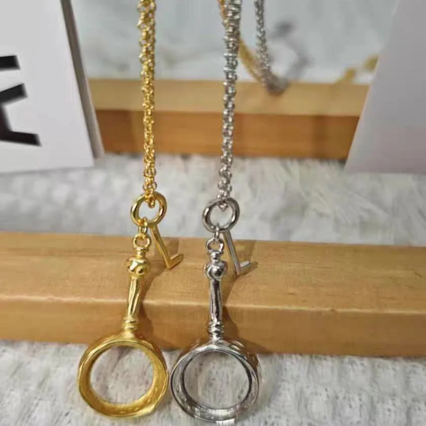 Sleek and Exclusive Golden Retro Magnifying Glass Long-sleeved Sweater Chain