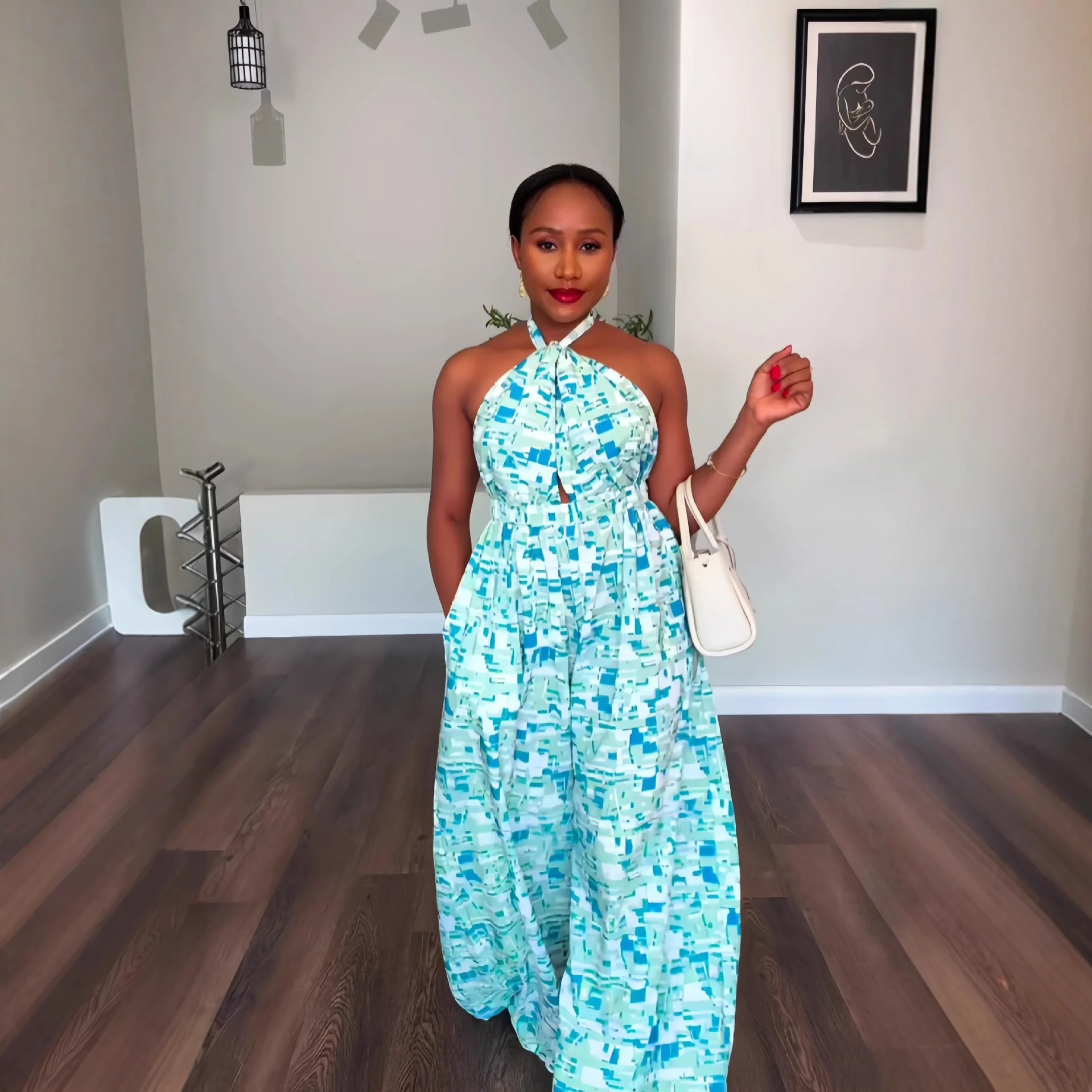 

Women's 2026 Winter New Sleeveless Halter Neck Tie-Back Printed Backless Waist-Cinching Wide-Leg Jumpsuit