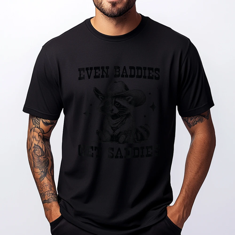 Even Baddies Get Saddies Funny Cowboy Raccoon Meme Graphic Tee Shirt ECO-FRIENDLY Gifts For Men New Years Eve