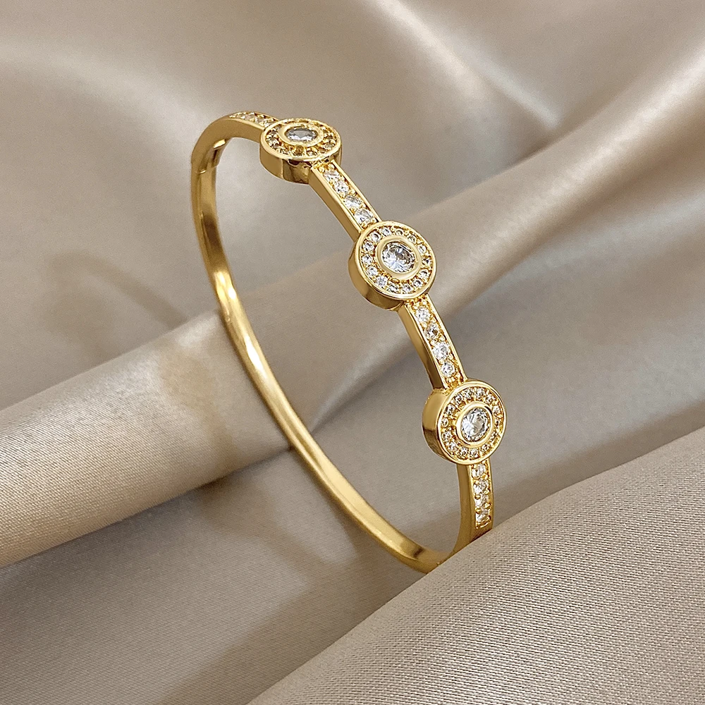

DODOHAO Trendy Inlaid Rhinestone Gold Plated Open Bangle Bracelet for Women Irregular Geometry Round Spring Bangle Daily Jewelry