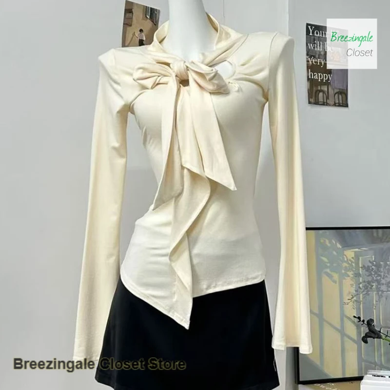 

French fashion design sense ruffled ribbon long-sleeved T-shirt women's spring and autumn new temperament chic Joker casual top.