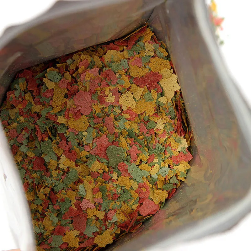 Alimento para peces Ornamental tropicales, accesorio para acuario, 100g, para peces pequeños, nutritivo, láminas de 3 colores