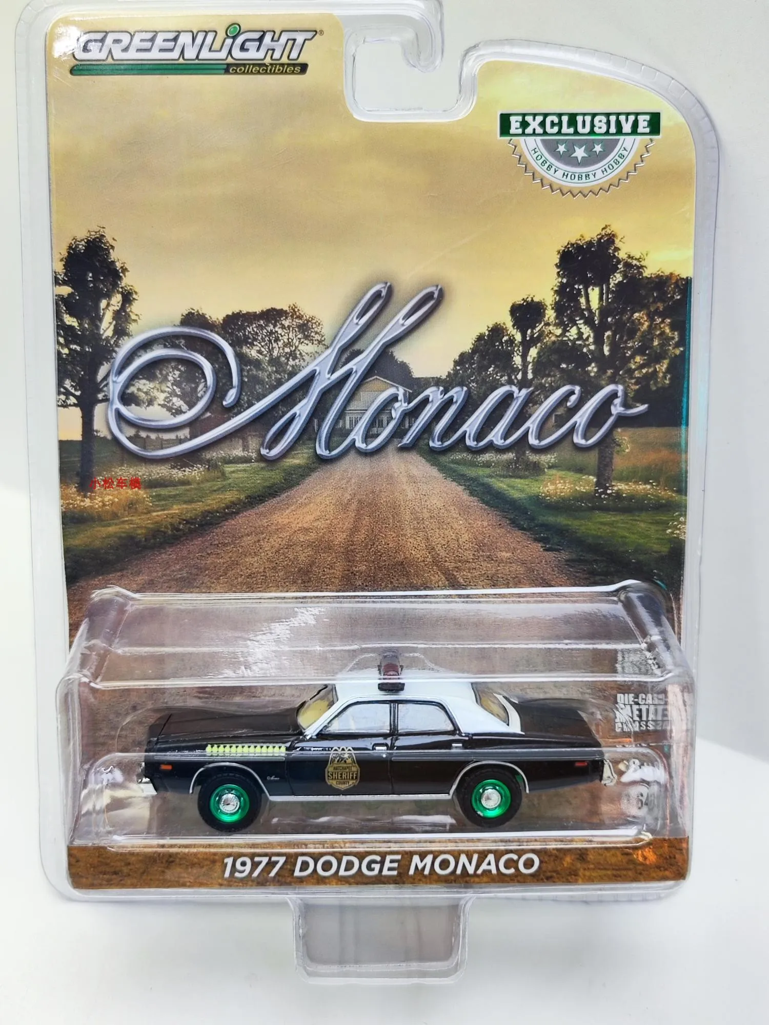 

Green Light 1:64 1977 Dodge Monaco - Hatchapee Dodge Mona Police Car Green Machine Edition