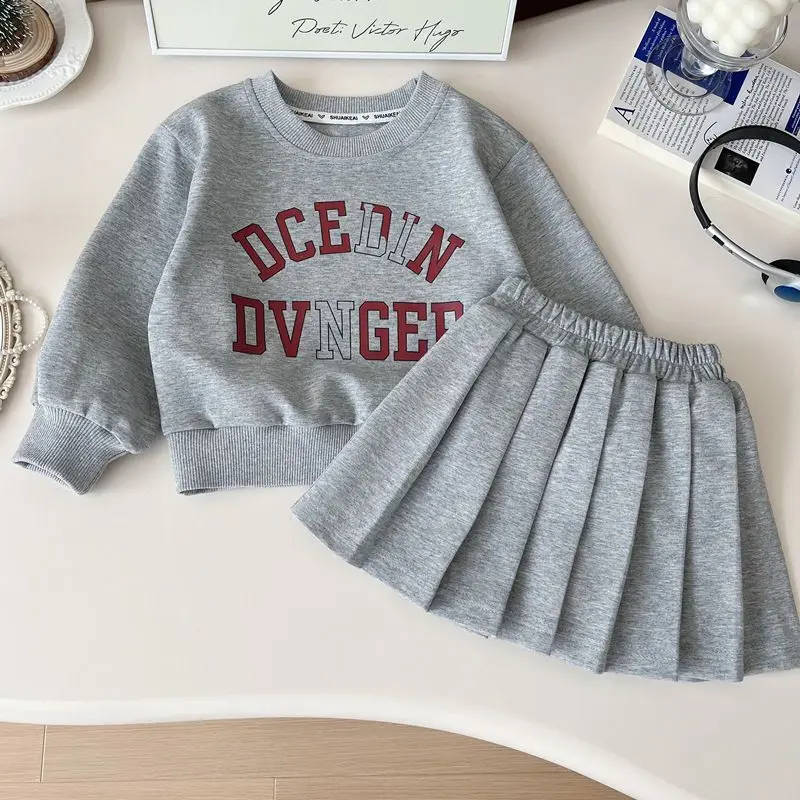 Abbigliamento per neonate Top stampato + gonna a pieghe Set 2 pezzi Abiti Set di vestiti alla moda per bambini 2-7 anni