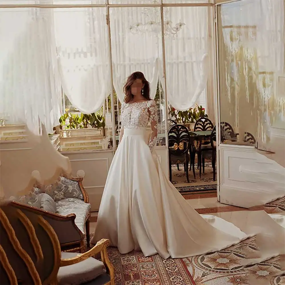 

Elegant Long Sleeve Boat Neck A Line Wedding Dress Appliques Bowknot Sexy Backless Bridal Gowns for 2025 Wedding Season