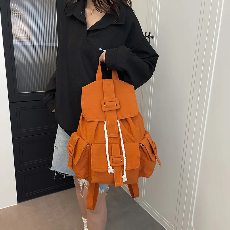 Chic bucket style pack with unique pocket layout crafted for students who love a one of a kind aesthetic
