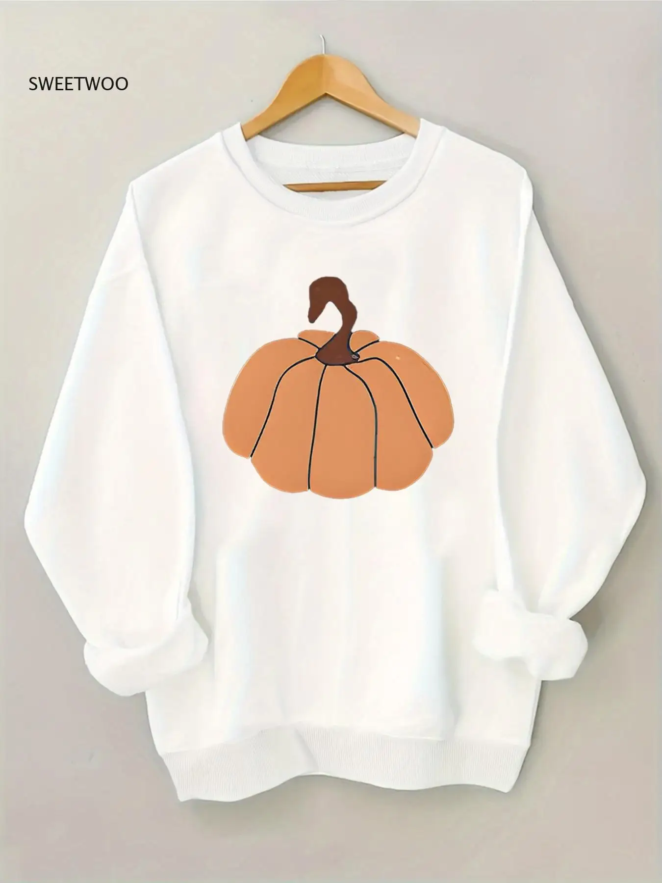 

Women's Cozy Black Sweatshirt with Pumpkin Graphic - Casual Loose Fit, Stretchy Ribbed Hem, Soft & Comfortable Fabric, Perfect