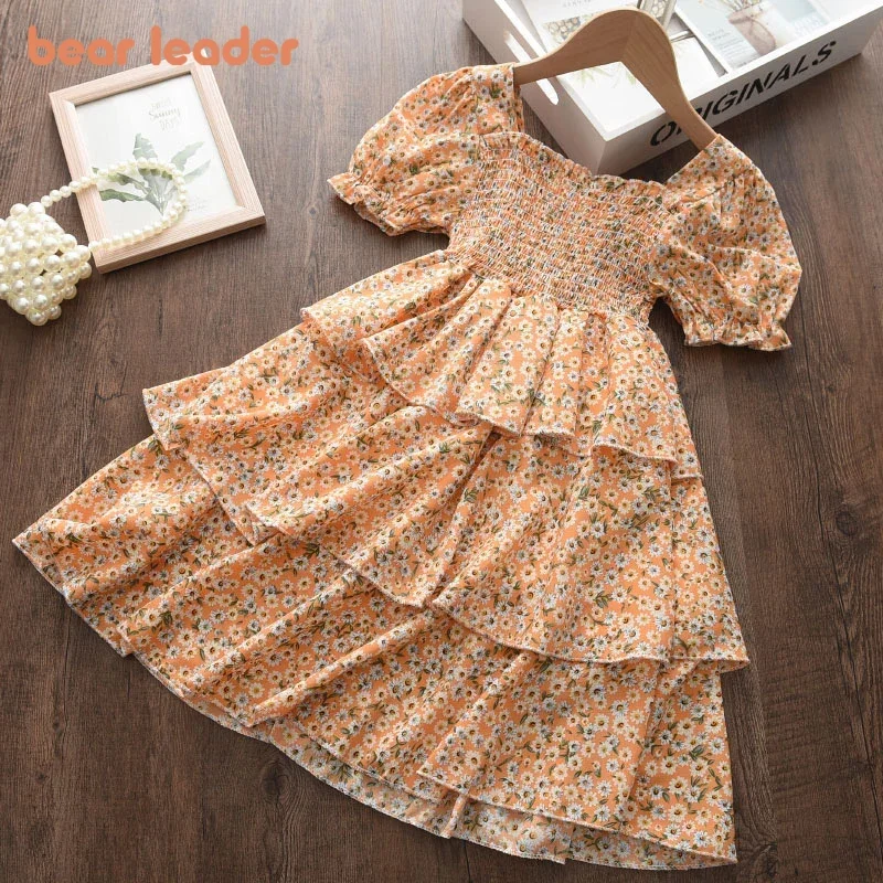 Bear Leader 2026 Sommer Neues Orange Blumenmuster Mädchenkleid Quadratischer Ausschnitt Puffärmel Ländlicher Stil Prinzessinnenkleid