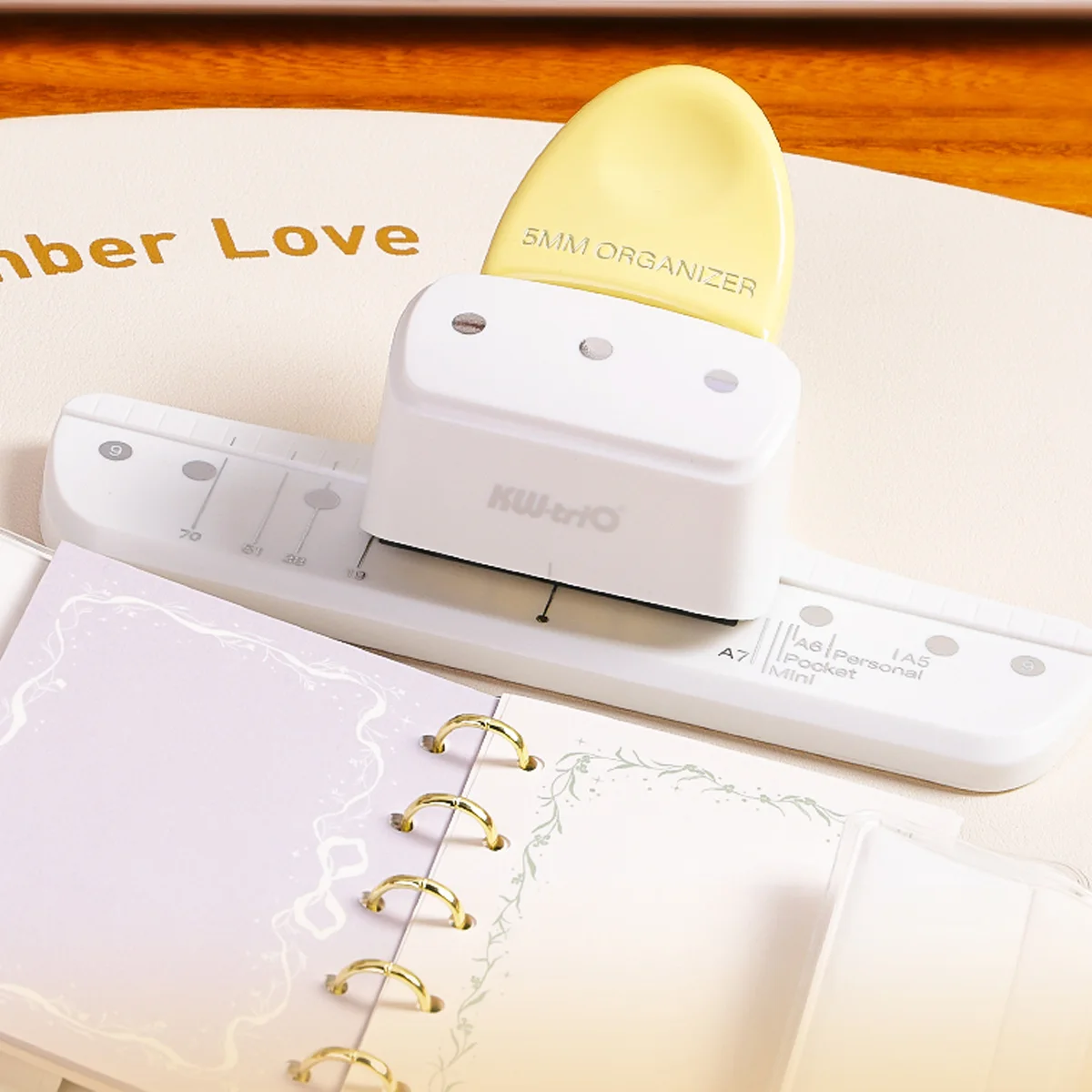 

Yellow three-hole punch, suitable for loose-leaf binder binding, document organization, and office and school materials.