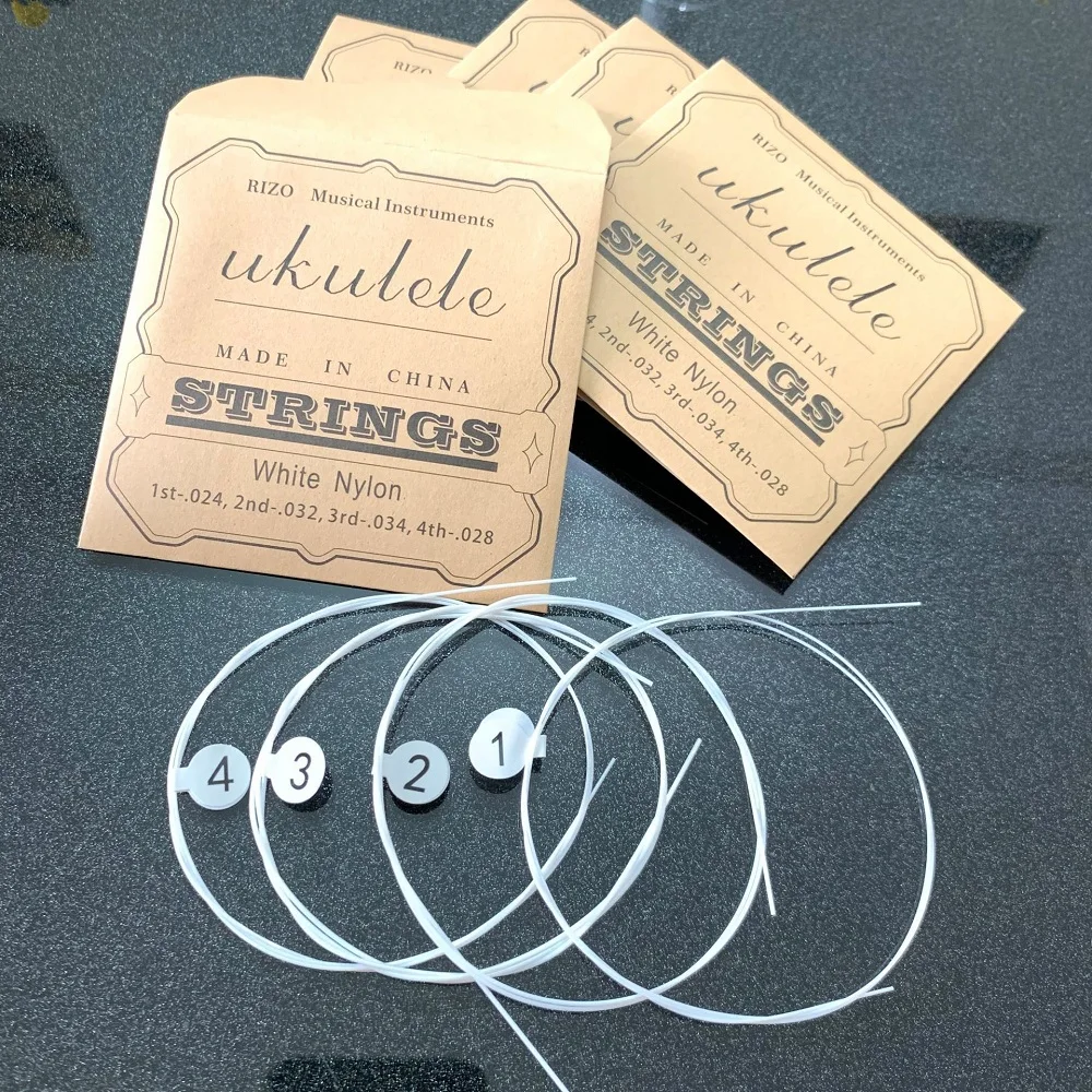 Juego de cuerdas para ukelele, cuerdas blancas de nailon coloridas de fibra de carbono para ukelele de 4 cuerdas