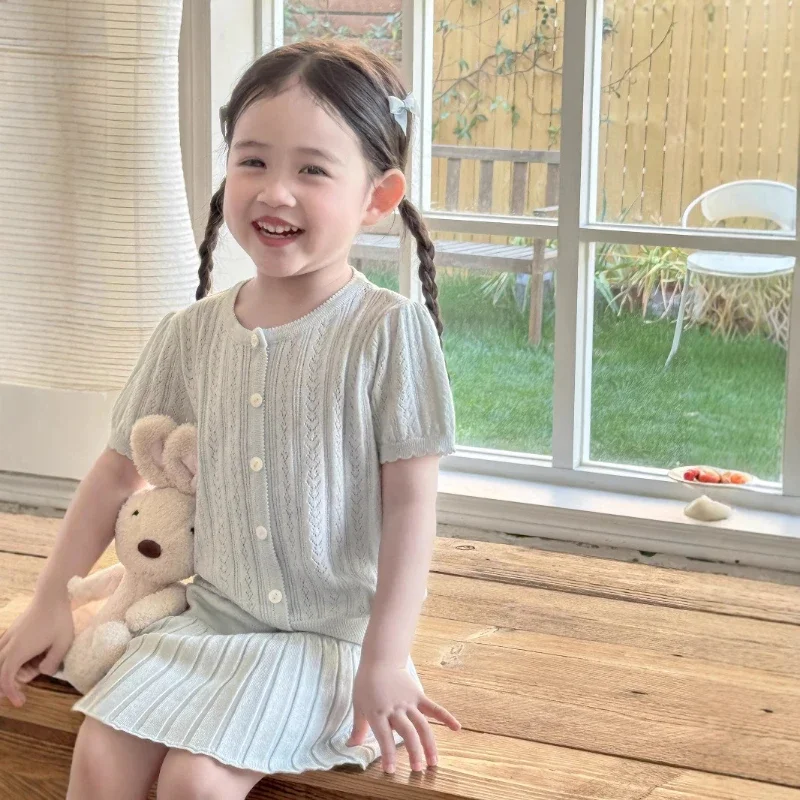 

2025 Summer Girls' Light Green Knitted Lyocell Hollow Short Sleeve and Half Skirt Two Piece Set
