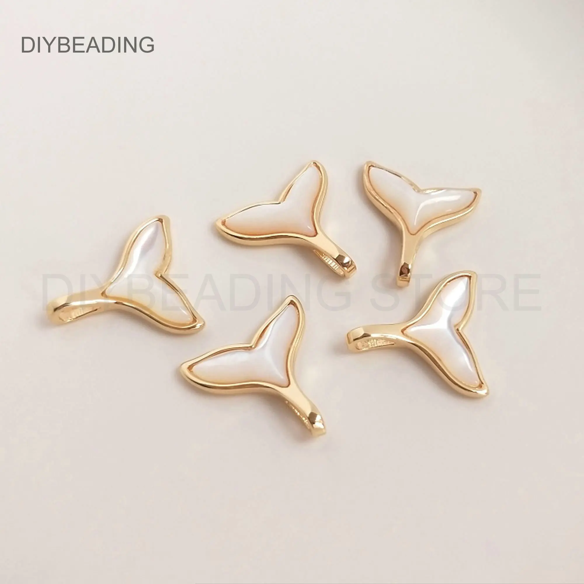 

DIY Jewelry Charms Online Wholesale 14K Gold Plated Brass and Natural MOP Shell Whale Tail Ocean Pendant Finding Bulk Supply