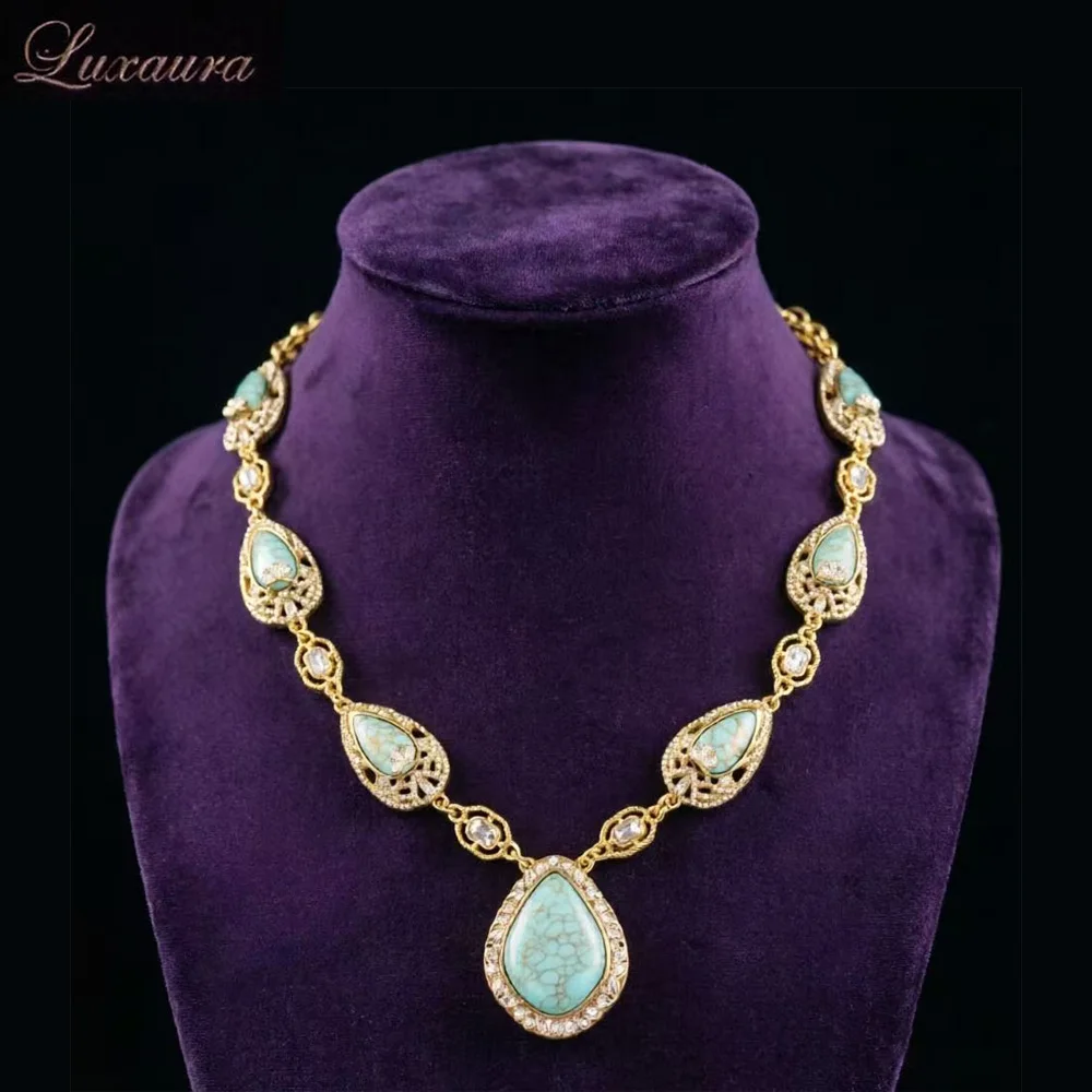 

Vintage jewelry featuring a fashionable and classic blue geometric necklace design paired with Bohemian style women's necklace