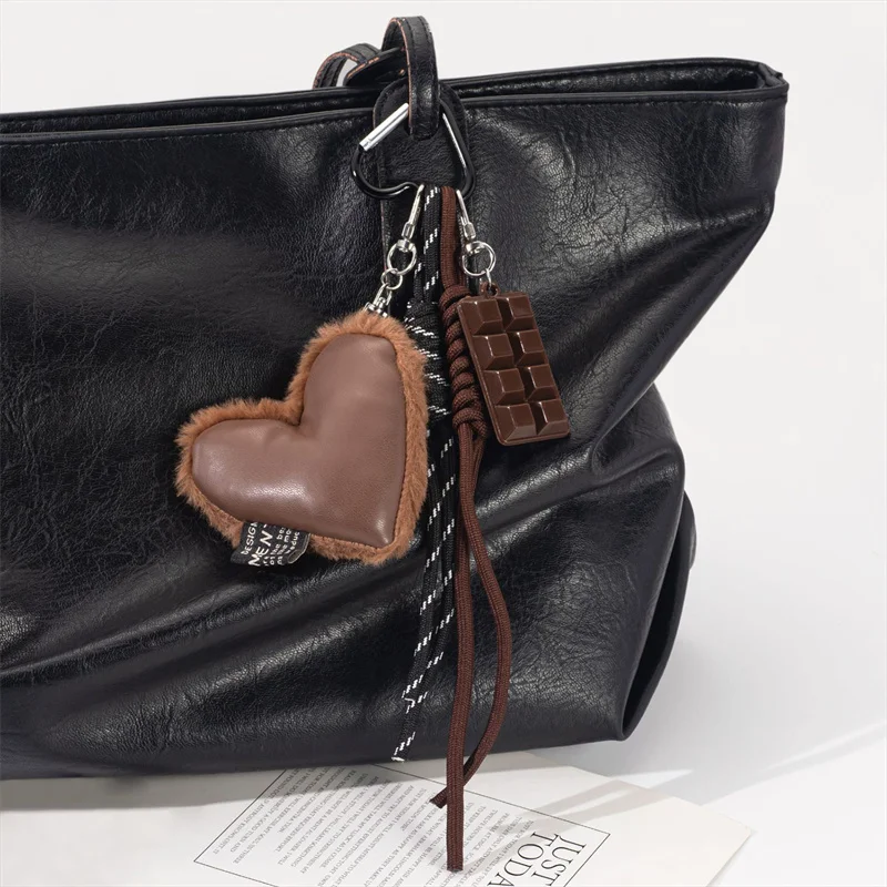 الإبداعية الشوكولاته موضة جديدة براون على شكل قلب بسيط اليدوية حبل مضفر حقيبة سلسلة مفاتيح قلادة سيارة الديكور