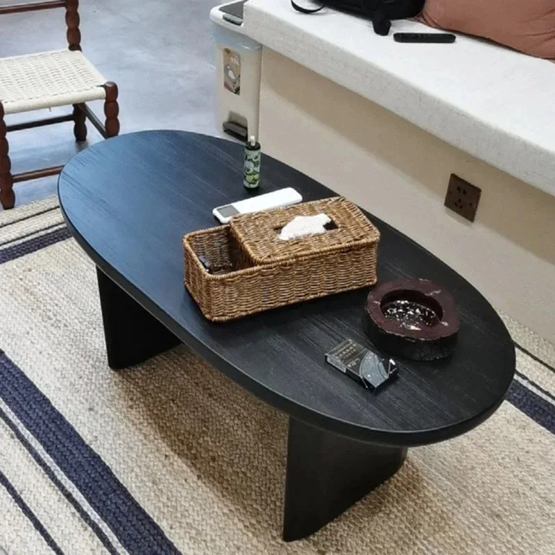 Gehobene kreative ovale minimalistische Wohnzimmer-Couchtische, nordische Massivholz-Café-Tische in Schwarz für Café-Möbel, Couchtische