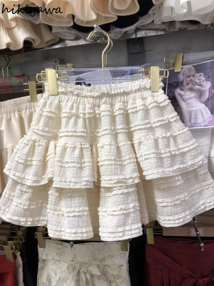 Falda acampanada De cintura alta para Mujer, minifalda japonesa con pliegues De encaje, color blanco, a la Moda, verano, 2024