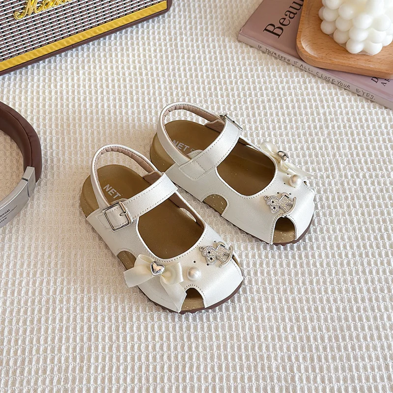 

Модные универсальные сандалии для девочек, новинка лета 2023 года, детские повседневные сандалии на мягкой подошве с бантом для девочек, обувь принцессы, нескользящая детская пляжная обувь