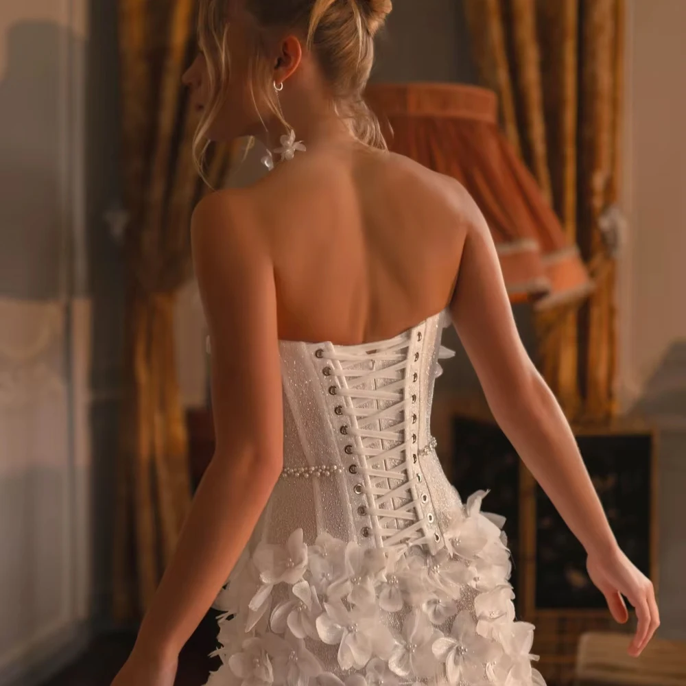 Aangepaste glitter 3D bloemen trouwjurk voor vrouw bruid elegante dromerige strapless bruidsjurk 2026 mouwloze bruidsjurk