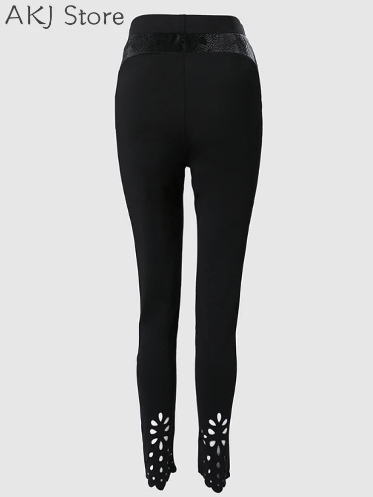 Bloemen uitgeholde skinny broek met asymmetrische zoom en elastische taille