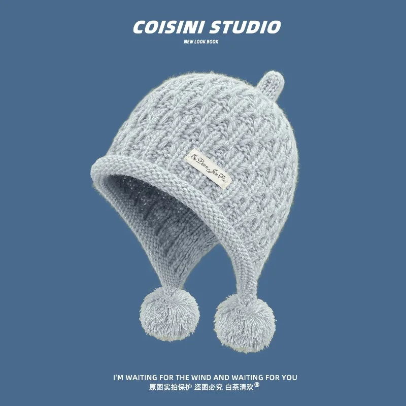 Women Cable Knit Earflap Beanies with Double Pom Poms Label Decor Soft Fluffy Knitted Hat Winter Warm Windproof Bonnet Cap