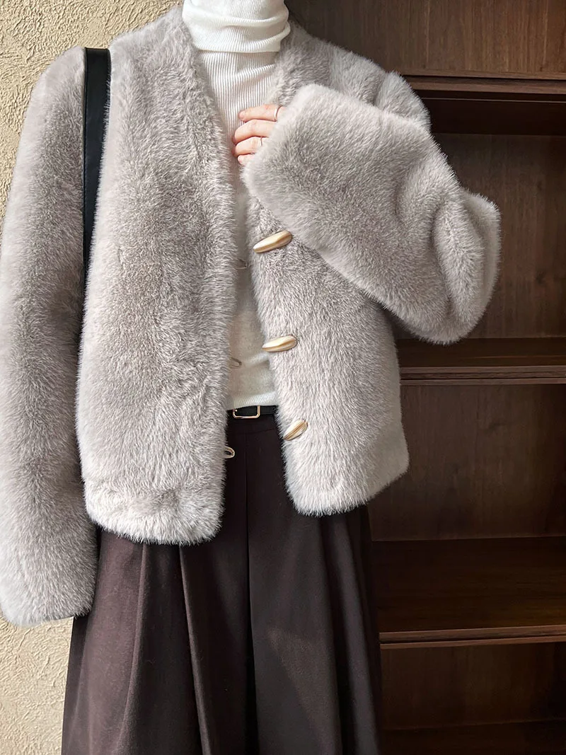 A short eco-friendly fur coat for women in winter, with a V-neck and horn-button faux mink