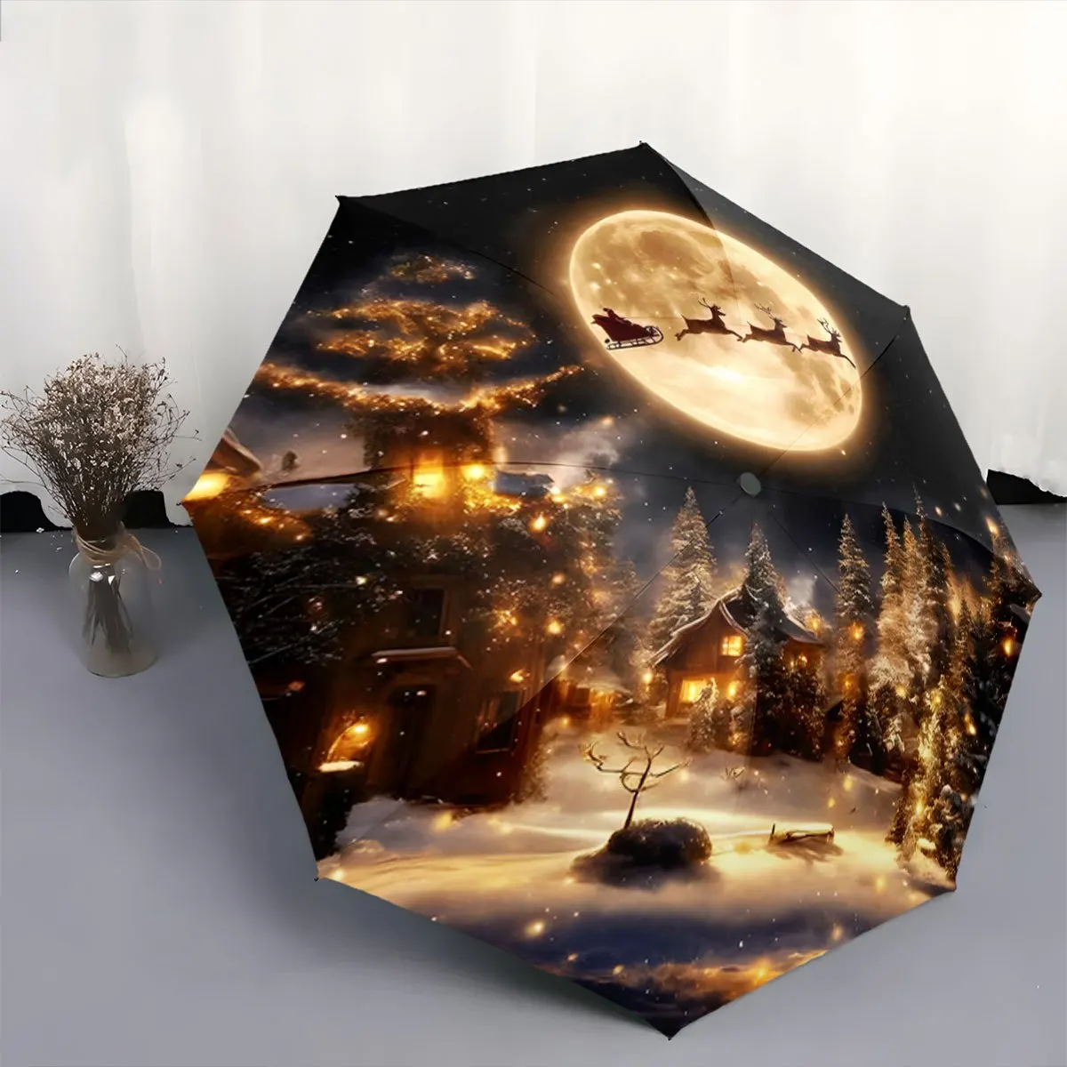 

Автоматический складной зонт. На зонтике изображена снежная деревня с Санта-Клаусом, летающим над полной луной. Портативный складной