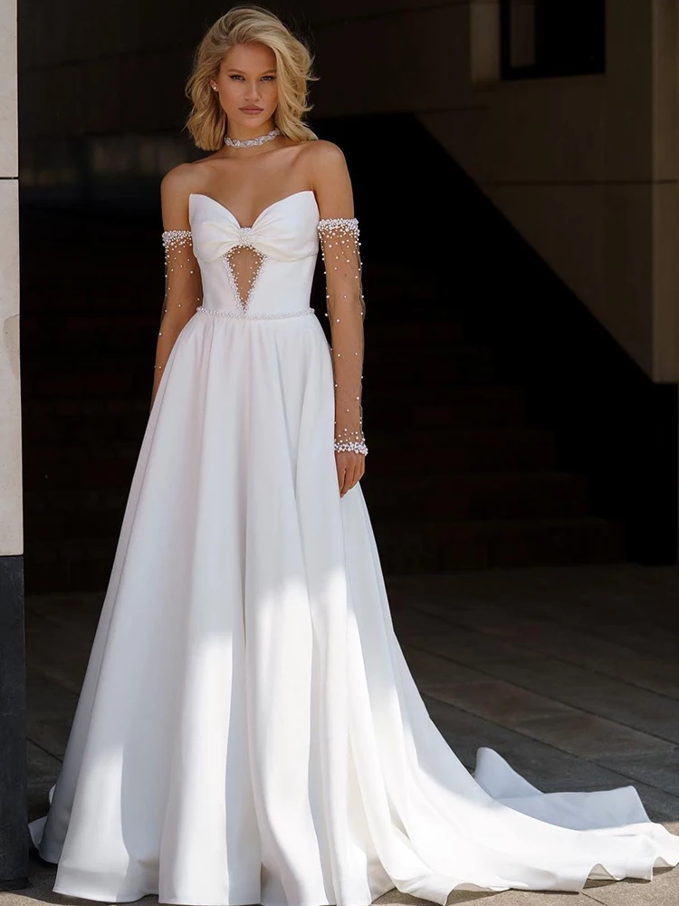 فستان زفاف مكشوف الكتفين من الساتان مع فيونكة لؤلؤ على شكل حرف a بدون حمالات وأكمام طويلة فستان عروس مخصص فيستدو دي نوفيا