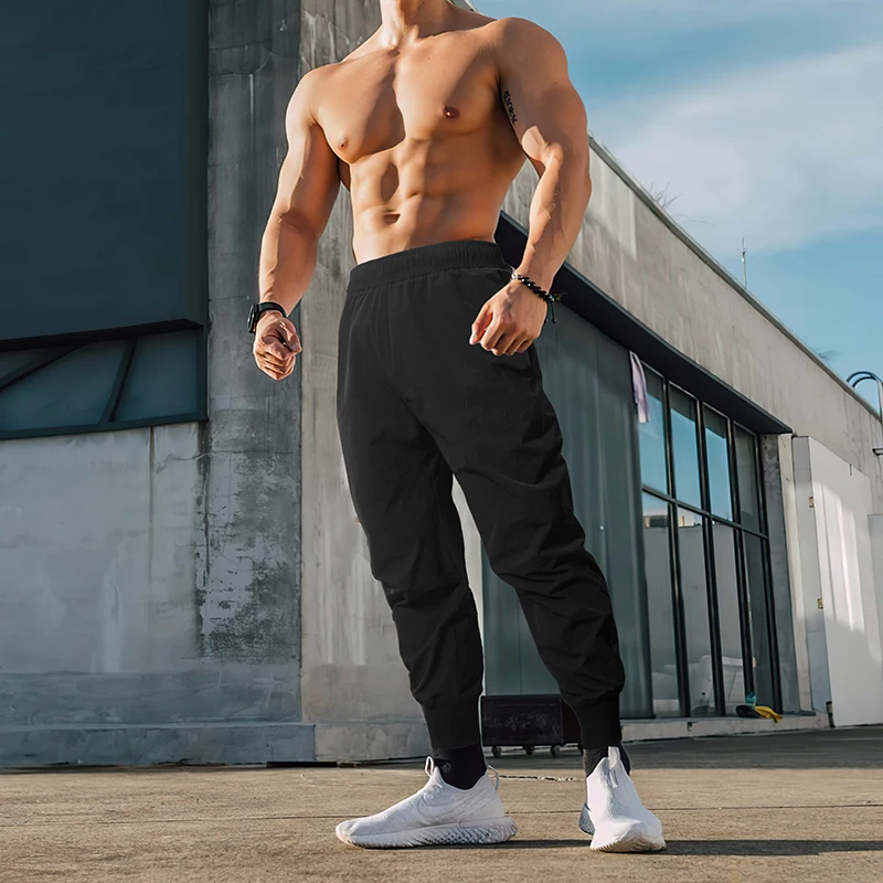 

Men's Gym Solid Color Pants Casual Mens Tracksuit Sportswear Bottoms Fitness Workout Skinny Joggers Elastic Waistband Pants