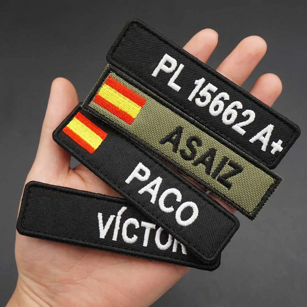 Etiquetas personalizadas con nombre de la bandera de ES, parche bordado, planchado en el respaldo del gancho