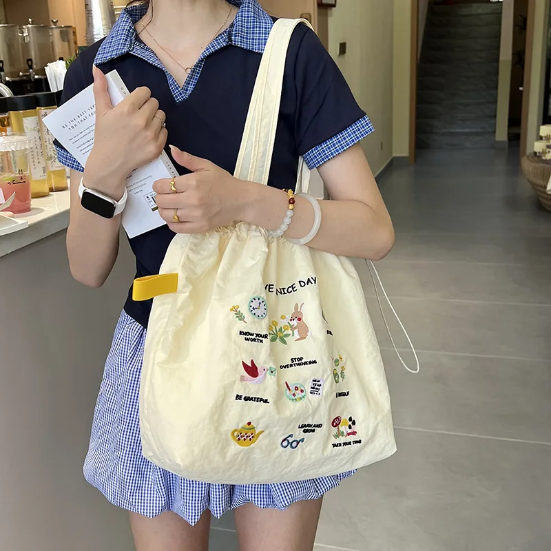 

Large capacity shoulder bag cute embroidery versatile literary drawstring lazy wind spring and summer candy color