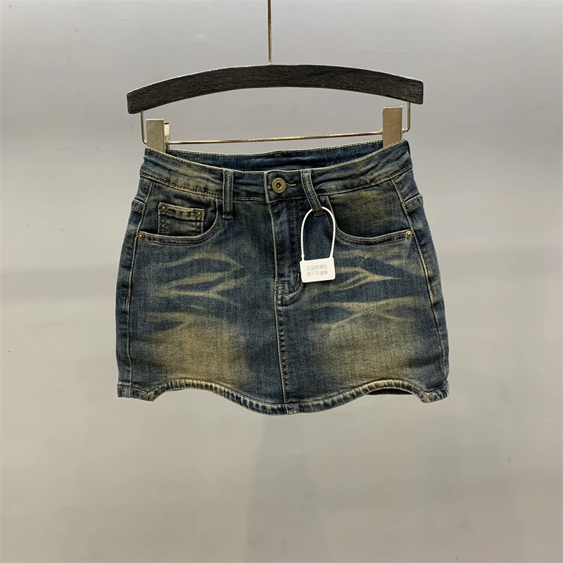 Saia curta jeans de nicho para meninas, mostrando pequena figura fina, embrulhado em linha A, mulheres, senso de design, novo estilo, 2022