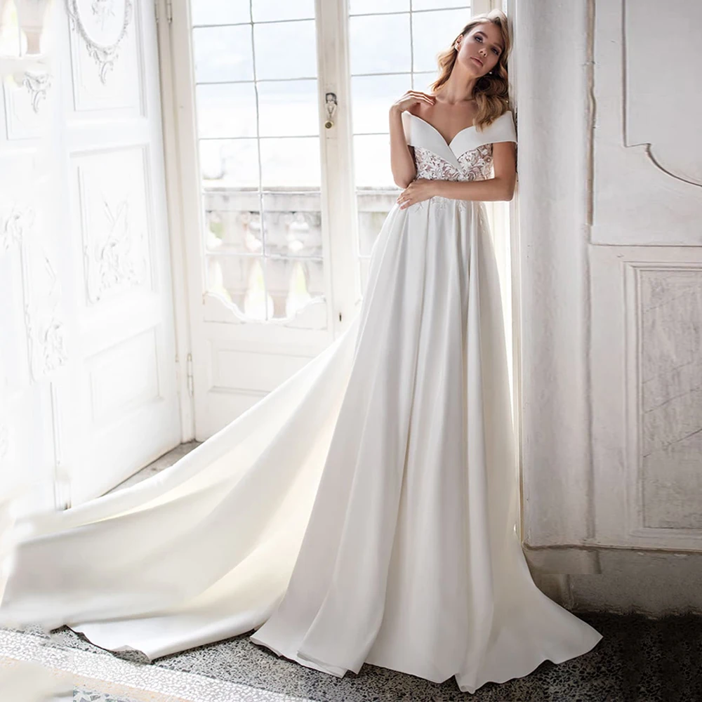 Vestido de novia de satén clásico con hombros descubiertos, cuello en V, apliques transparentes de flores, línea A, tren de corte, vestido de novia con bolsillos