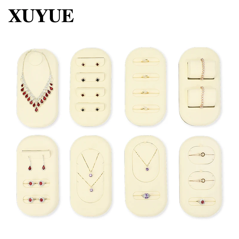 Jewelry counter displays rings, earrings, bracelets, necklaces, trays, jewelry viewing displays, and plates