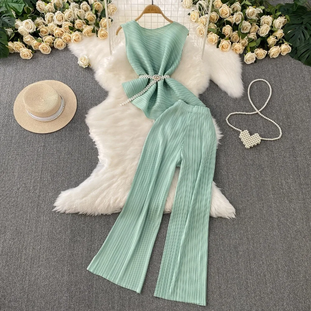 

Сексуальные комплекты из двух предметов. Шикарный плиссированный топ без рукавов с асимметричной цепочкой и модные комплекты с широкими брюками с высокой талией.