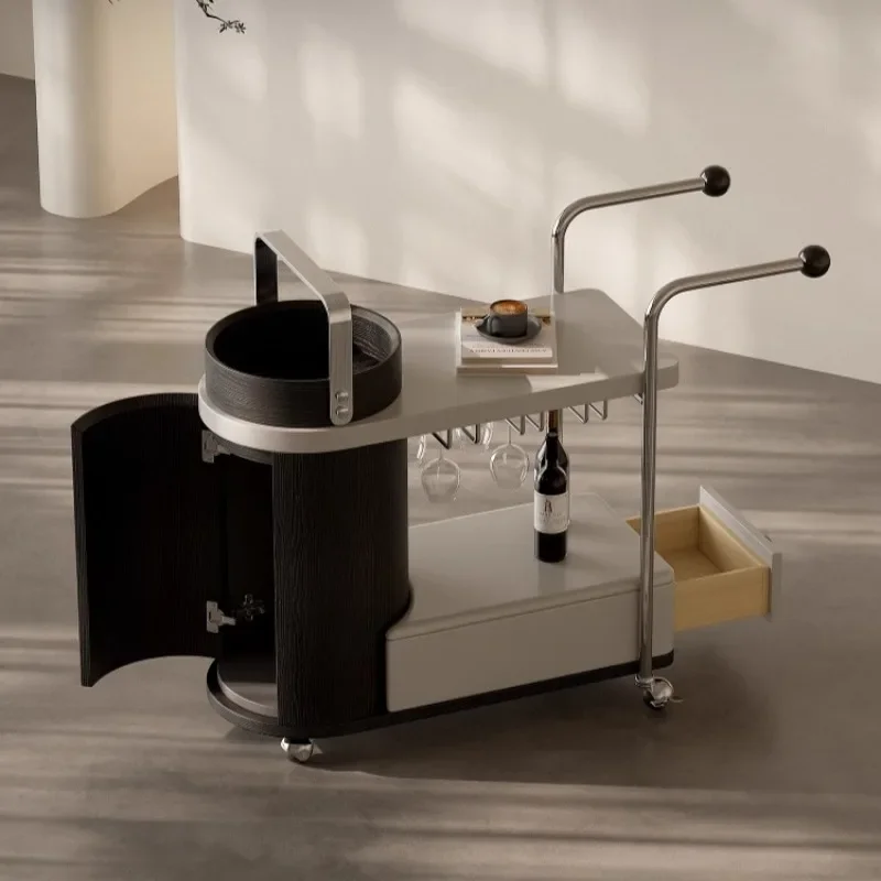 A few wheeled trolleys on the side of the movable sofa