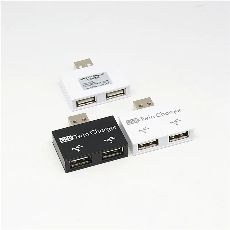 T85C محور USB صغير محمول إلى 2 منفذ شاحن مهايئ توزيع USB فاصل مزدوج USB شحن موسع للهاتف الكمبيوتر الأبيض