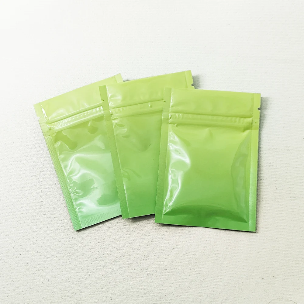 

Glossy Resealable Mylar Zip Lock Packing Pouch with Tear Notch 100pcs Yellow Green Flat Self Seal Aluminum Foil Wrapping Bags