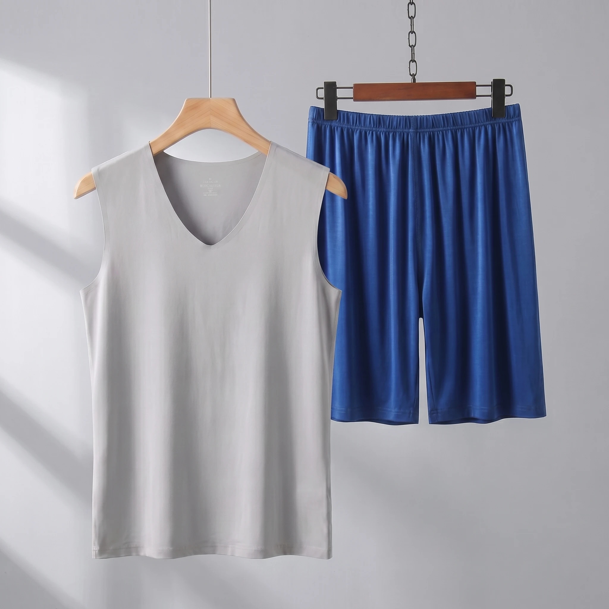 Gray vest + dark blue shorts