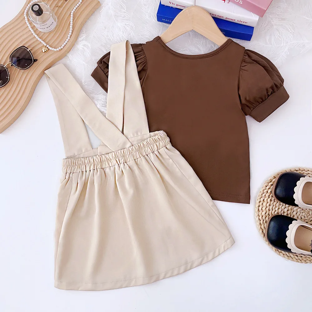 2024 New Child Clothes Sets Short Puff Sleeve O Neck Brown T-shirt Suspender Skirt 2 Piece Sets Designer Girls Clothes Set 3-7T